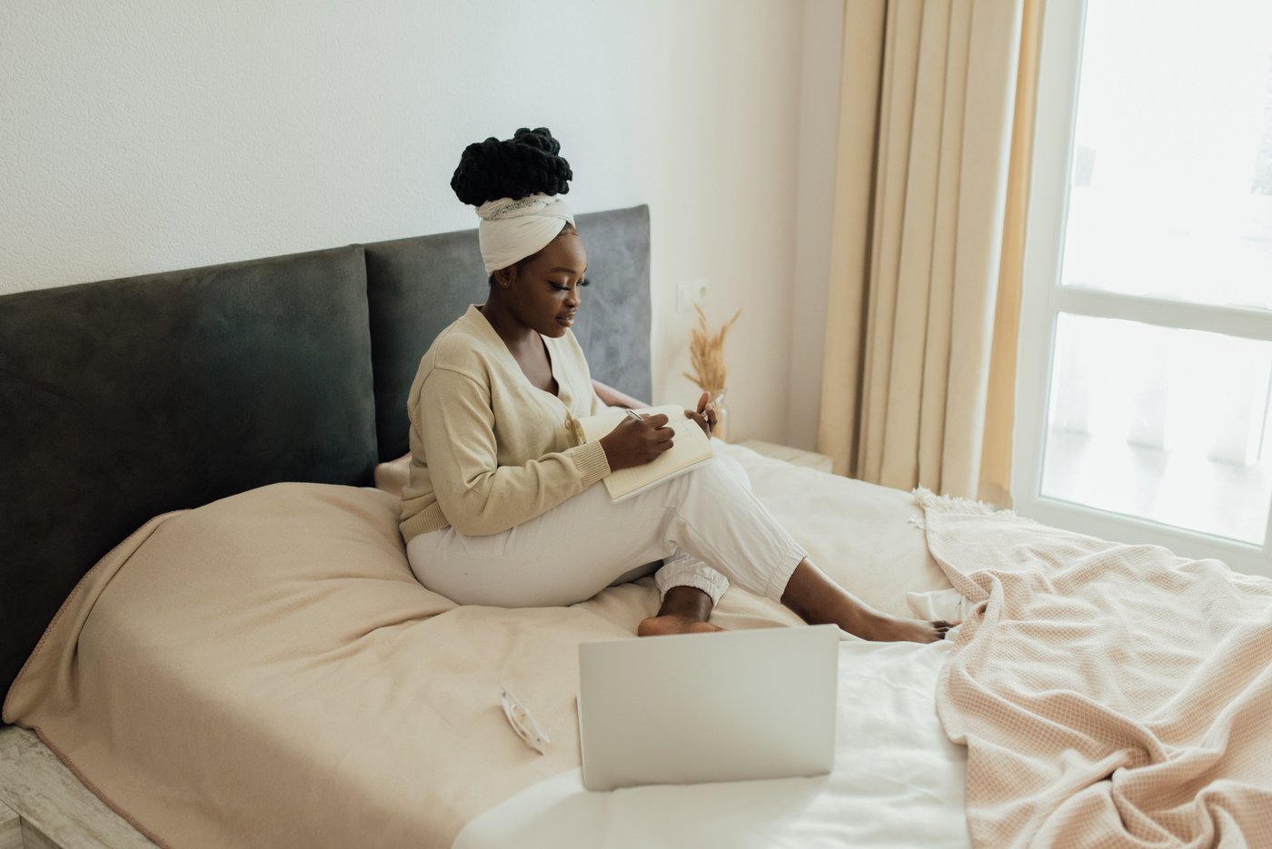 A Woman Writing in Bed